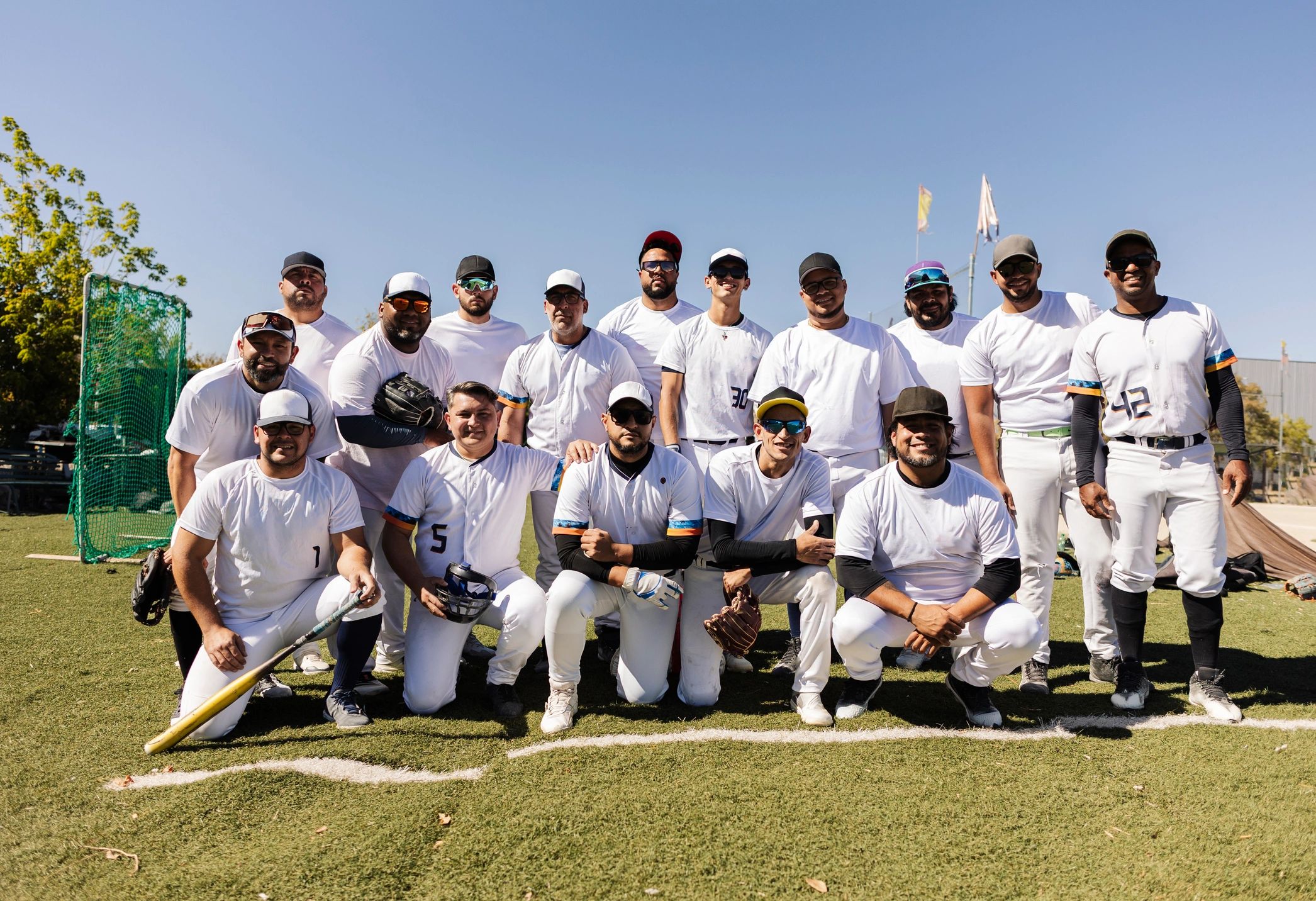 Baseball team wearing coordinated custom jerseys on a field